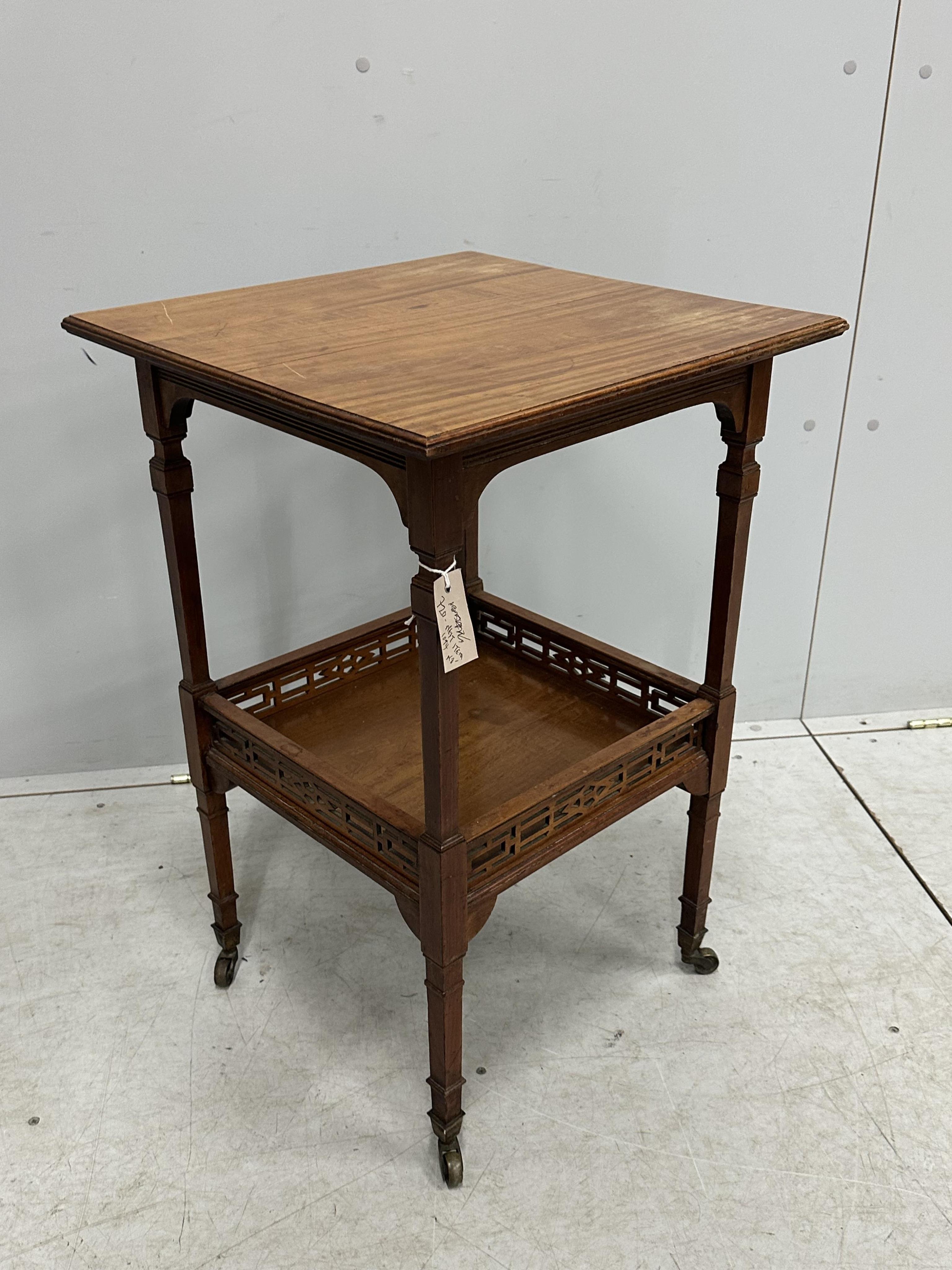 A late Victorian Aesthetic Movement satinwood two tier occasional table, width 48cm, depth 47cm, height 73cm. Condition - fair